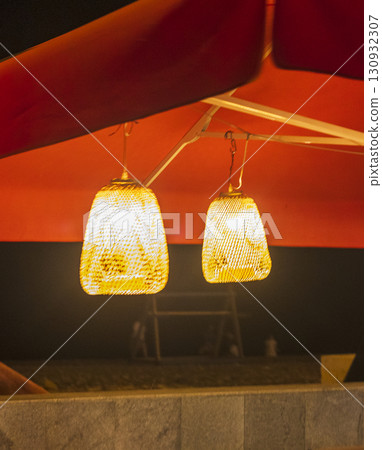 Two outdoor lamps shining at night 130932307