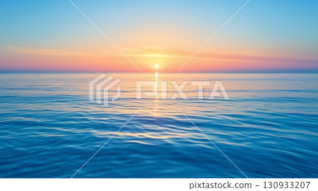 Sunset over the sea, soft sky as the sun descends, its light casting a path across the calm waters 130933207