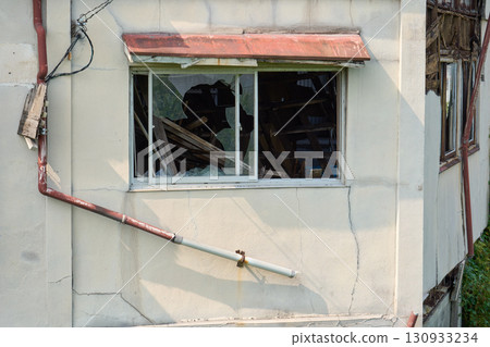 A dilapidated house. The exterior of the building symbolizes the problem of vacant houses. 130933234