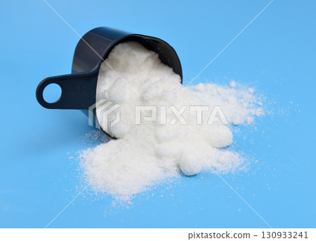 Metronidazole powder on blue background 130933241