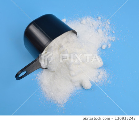 Metronidazole powder on blue background Metronidazole powder on blue background 130933242