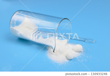 Metronidazole powder on blue background Metronidazole powder on blue background 130933246