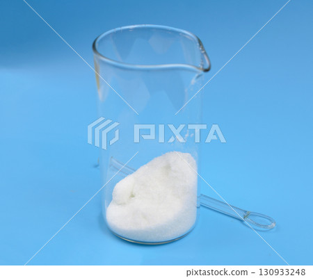 Metronidazole powder on blue background Metronidazole powder on blue background 130933248