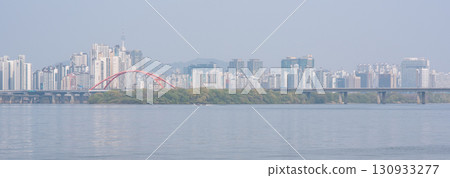 Smog pollution and yellow dust covering cityscape of Seoul, capital of South Korea 130933277