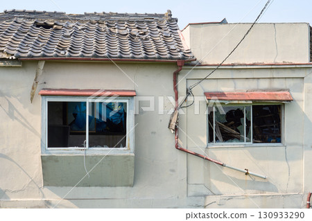 A dilapidated house. The exterior of the building symbolizes the problem of vacant houses. A dilapidated house. The exterior of the building symbolizes the problem of vacant houses. 130933290