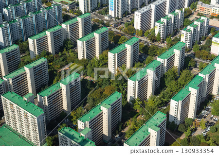 Panoramic cityscape aerial view of residential apartment blocks in downtown Seoul, capital of South Korea Panoramic cityscape aerial view of residential apartment blocks in downtown Seoul, capital of South Korea 130933354