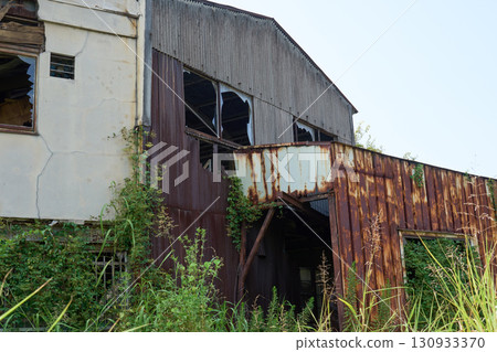 The ruins of a dilapidated factory. The exterior of the building symbolizes the problem of vacant houses. The ruins of a dilapidated factory. The exterior of the building symbolizes the problem of vacant houses. 130933370