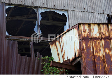 The ruins of a dilapidated factory. The exterior of the building symbolizes the problem of vacant houses. 130933373
