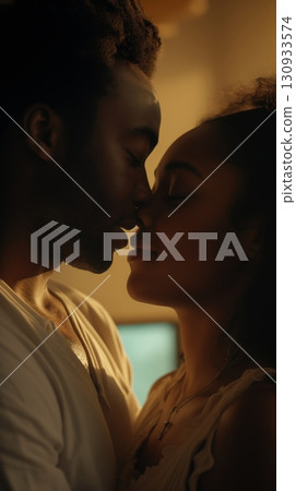 Delicate pink lotus flower gently resting on the water surface among green leaves with water droplets tranquility Delicate pink lotus flower gently resting on the water surface among green leaves with water droplets tranquility 130933574