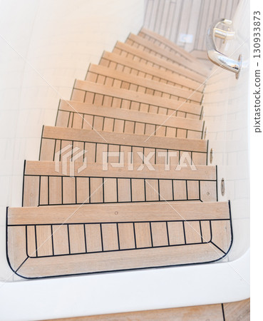 Teak stairs ladder on luxury yacht. Elements of yacht construction. Superyacht concept. 130933873