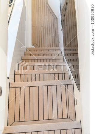 Teak stairs ladder on luxury yacht. Elements of yacht construction. Superyacht concept. 130933950