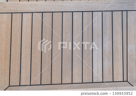 Teak wood deck texture background. Wooden deck on super yacht. Yachting concept. 130933952