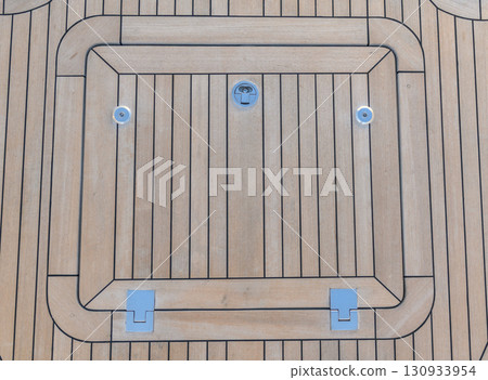 Teak hatch cover on deck luxury yacht. Elements of yacht construction. Superyacht concept. Teak hatch cover on deck luxury yacht. Elements of yacht construction. Superyacht concept. 130933954