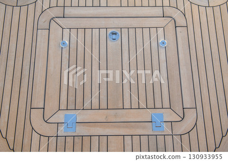 Teak hatch cover on deck luxury yacht. Elements of yacht construction. Superyacht concept. Teak hatch cover on deck luxury yacht. Elements of yacht construction. Superyacht concept. 130933955