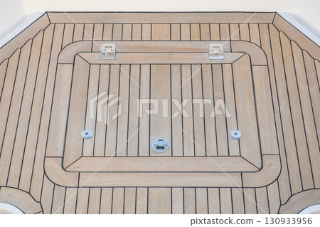 Teak hatch cover on deck luxury yacht. Elements of yacht construction. Superyacht concept. 130933956