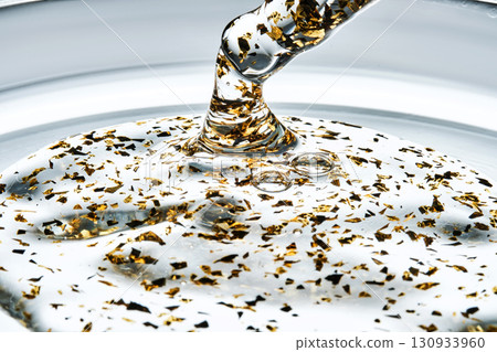 Mouth-watering thick texture of 24k gold serum. 130933960