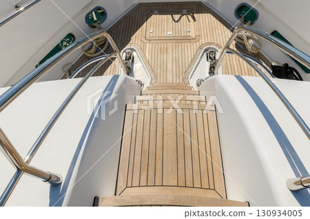 Fore deck of luxury super yacht. Teak deck on luxury yacht. Superyacht concept. 130934005