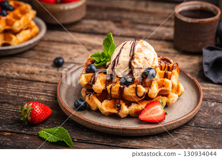 Tasty Belgian waffles with fresh berries 130934044