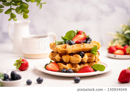 Tasty Belgian waffles with fresh berries Tasty Belgian waffles with fresh berries 130934049