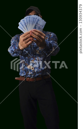 Currency details showcasing intricate designs and patterns of banknotes used in everyday transactions in a market setting 130934379