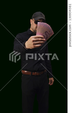 Collection of colorful banknotes from Thailand showcasing various denominations and intricate designs in vibrant detail 130934381