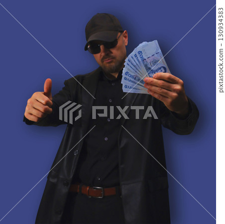 Close-up view of banknotes displaying intricate designs and details in vibrant colors and patterns 130934383