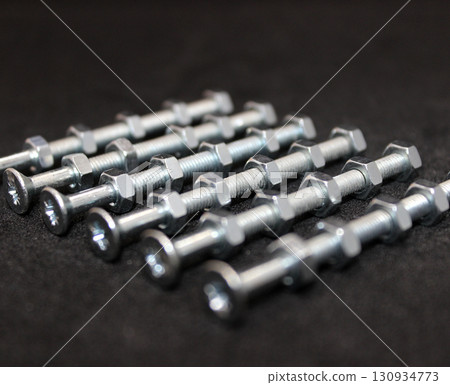 Hex Nuts On A Threaded Hex Bolts Isolated On Black Angle View With Soft Focus Stock Photo 130934773