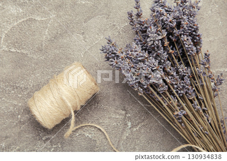 Lavender flowers on grey concrete background. Floral composition. Lavender flowers on grey concrete background. Floral composition. 130934838