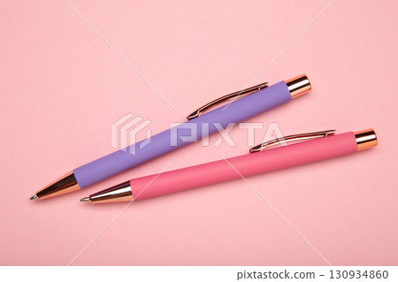Pink and purple pens on pink background 130934860