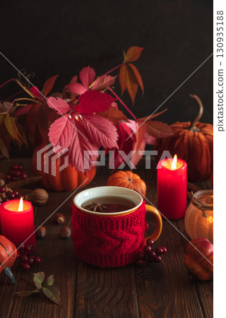 Cozy Autumn Scene with Mulled Wine, Candles, Pumpkins and Seasonal Decor Cozy Autumn Scene with Mulled Wine, Candles, Pumpkins and Seasonal Decor 130935188