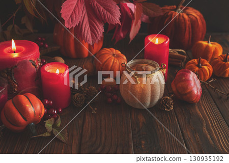 Autumn Still Life with Pumpkins, Candles and Seasonal Decorations 130935192