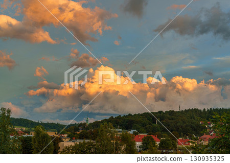 Stormy sky over the city of Kamienna Gora during sunset. Lower Silesia, Poland Stormy sky over the city of Kamienna Gora during sunset. Lower Silesia, Poland 130935325