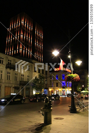 Beautiful illumination on modern city in night. illuminated street Beautiful illumination on modern city in night. illuminated street 130935699