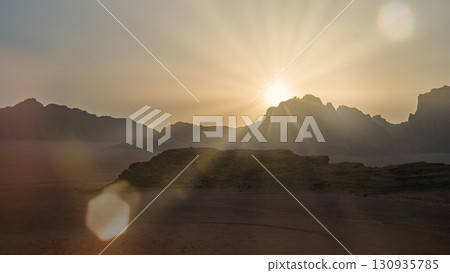 Sunrise over rocky mountains highlights the beauty of nature and the importance of conservation 130935785