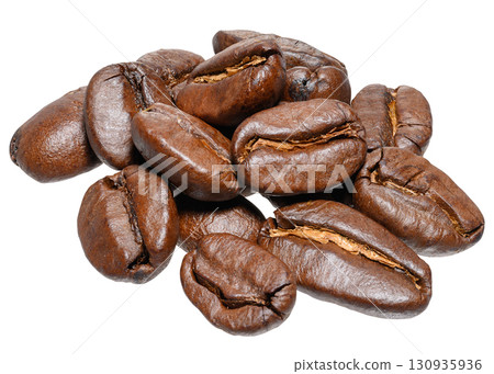 A handful of roasted coffee beans, shot close-up on an isolated background 130935936