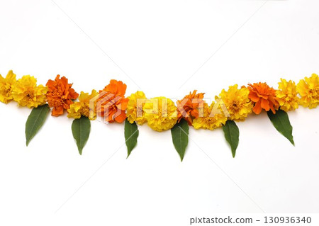 Yellow orange marigold flowers. Indian traditional floral festive garland toran. Zendu flowers, green leaves isolated on white background. Party decor. Diwali, Halloween. Dia de los Muertos holiday. Yellow orange marigold flowers. Indian traditional floral festive garland toran. Zendu flowers, green leaves isolated on white background. Party decor. Diwali, Halloween. Dia de los Muertos holiday. 130936340