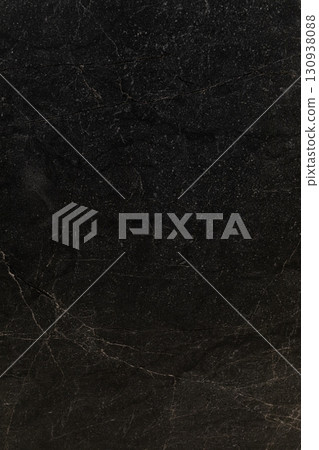 Dark textured stone surface with subtle patterns and natural imperfections suitable for various Dark textured stone surface with subtle patterns and natural imperfections suitable for various 130938088