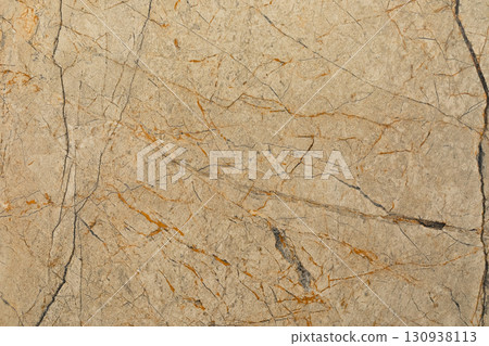 Natural stone surface showing unique patterns and textures with rich colors and veins Natural stone surface showing unique patterns and textures with rich colors and veins 130938113