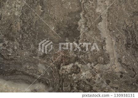 Rock formation with intricate patterns and textures in shades of gray and brown Rock formation with intricate patterns and textures in shades of gray and brown 130938131