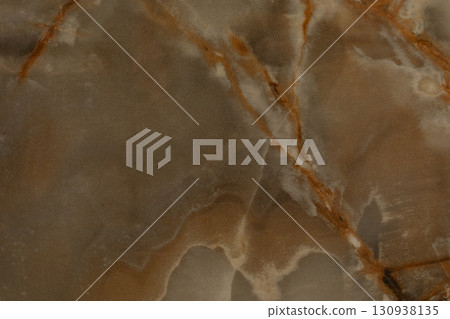 Swirls and veins of earthy tones in a beautiful natural stone texture showcasing rich color Swirls and veins of earthy tones in a beautiful natural stone texture showcasing rich color 130938135