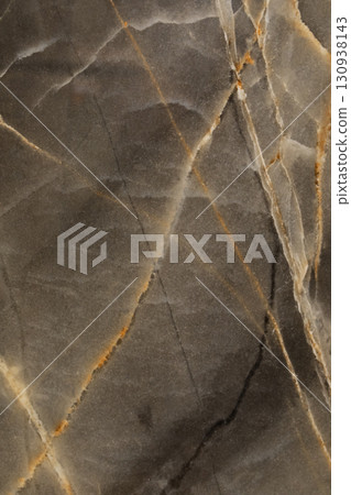 Unique black and gold marble texture showcasing natural patterns and lines in a striking design Unique black and gold marble texture showcasing natural patterns and lines in a striking design 130938143