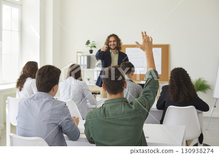 Teenage Schoolboy Raising Hand During Lesson Teenage Schoolboy Raising Hand During Lesson 130938274