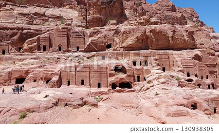 Tourists explore the rock-carved tombs of Petra Tourists explore the rock-carved tombs of Petra 130938305