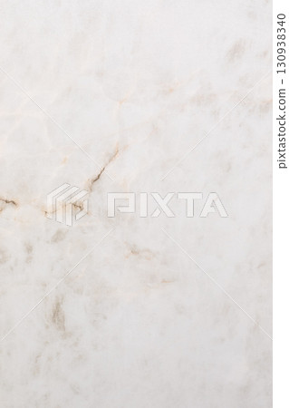 Smooth white marble surface with subtle veins and textures in natural light for elegant design 130938340
