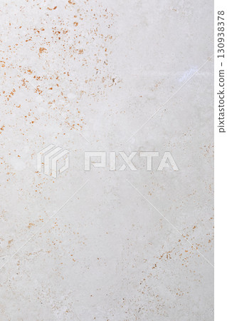 Light gray textured surface showcases natural patterns and subtle imperfections in indoor lighting 130938378