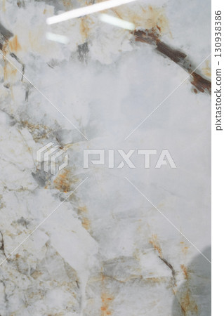 Beautiful white marble surface with veins and patterns showcasing natural textures and colors Beautiful white marble surface with veins and patterns showcasing natural textures and colors 130938386