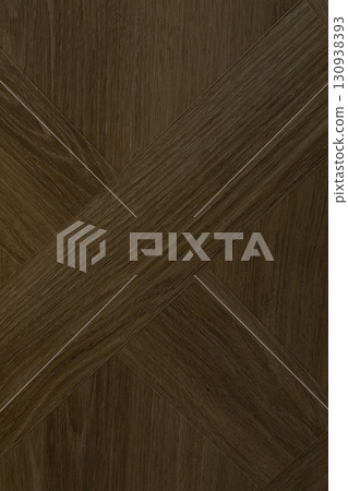 Wooden flooring with a crisscross pattern in a warm brown color creating an elegant interior Wooden flooring with a crisscross pattern in a warm brown color creating an elegant interior 130938393