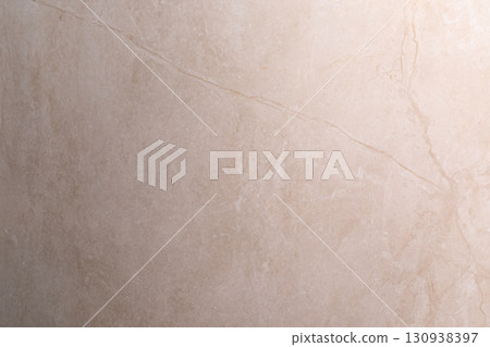 Light beige marble surface with subtle veins creating an elegant backdrop for various designs and 130938397