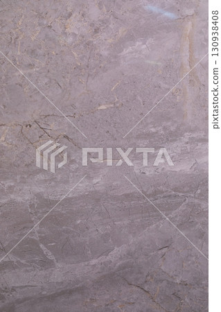 Beautiful textured stone surface with natural patterns in earthy tones from a quarry setting 130938408