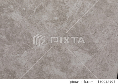 Surface with light grey marble patterns featuring natural texture and veining in varying shades and 130938591